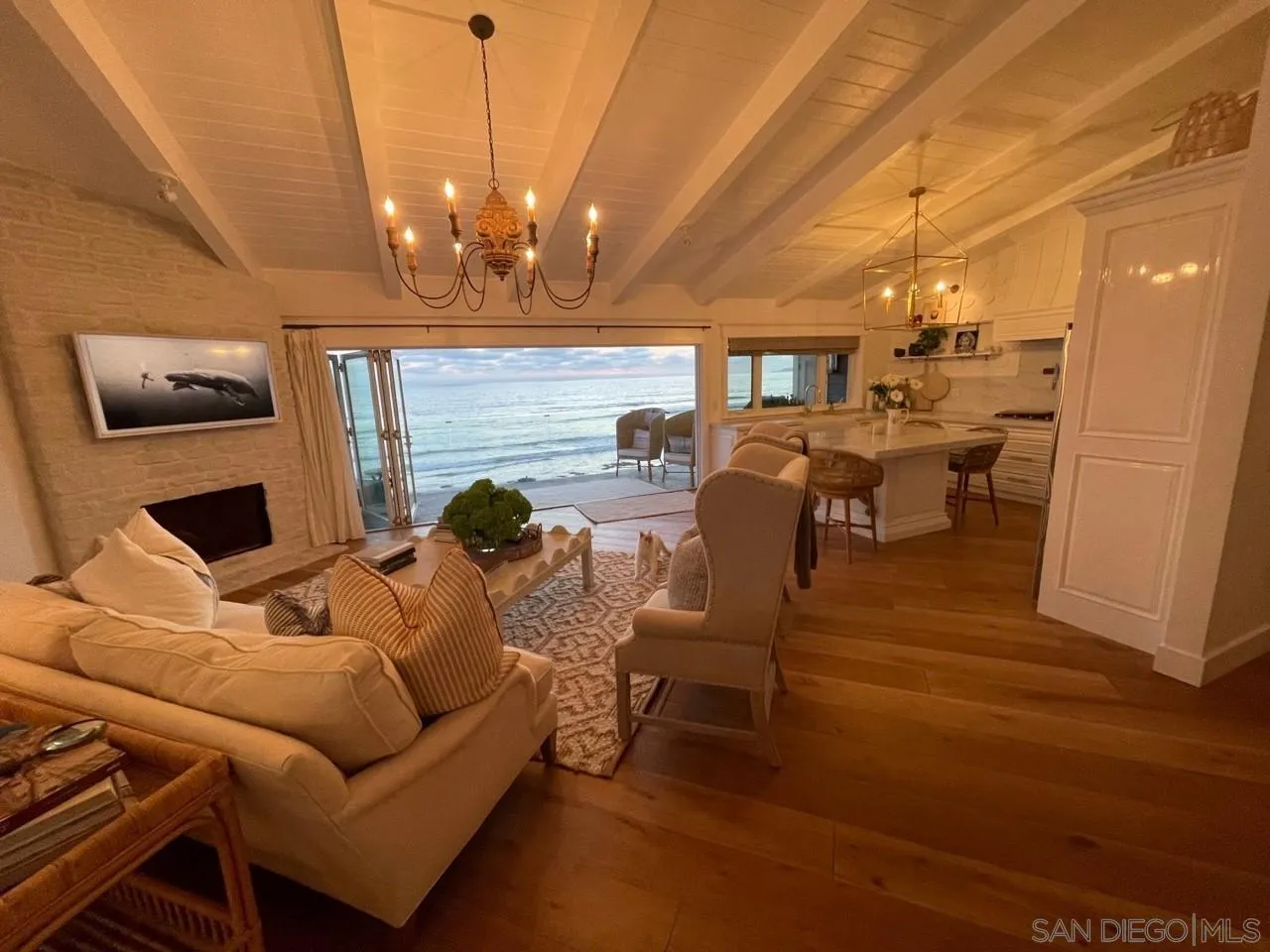 666 Ocean Lane Imperial Beach, CA 91932 - Photo 9 of 15 a living room with furniture a chandelier and a flat screen tv