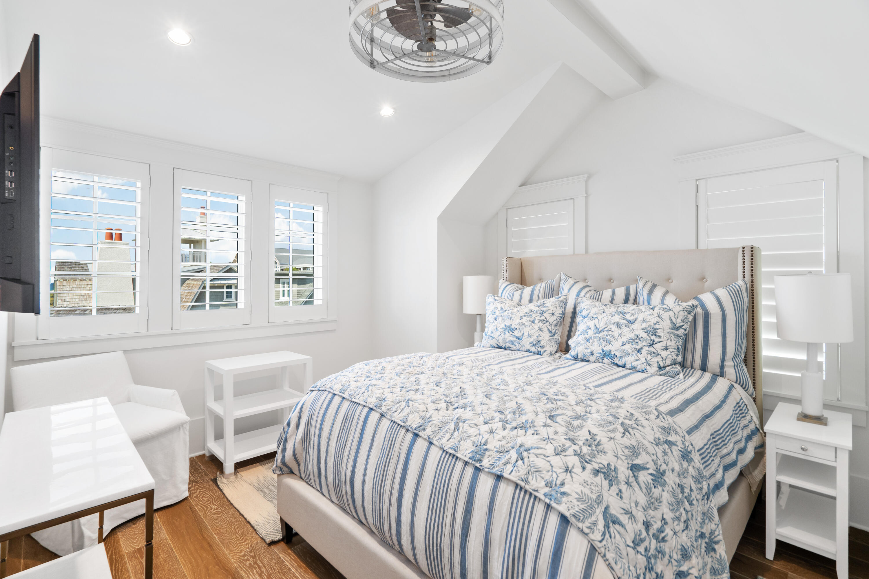 131 Compass Point Way Watersound, FL 32461 - Photo 54 of 110 a bedroom with a bed and a table with chair