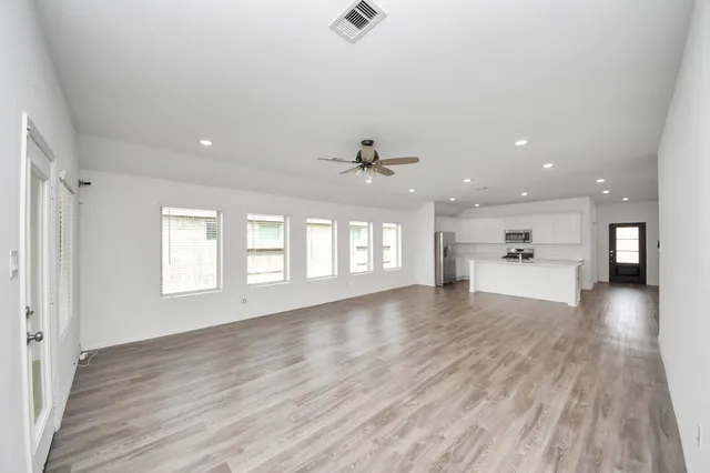 an aerial view of a house with a yard basket ball court and outdoor seating
