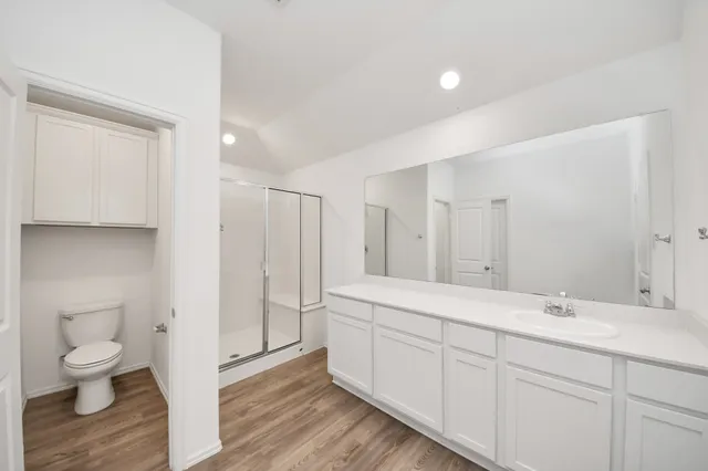 a view of a kitchen with a sink and a refrigerator