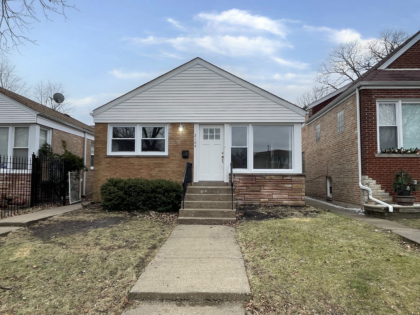 2104 North Mobile Avenue Chicago, IL 60639 - Photo 1 of 19 a front view of a house with garden