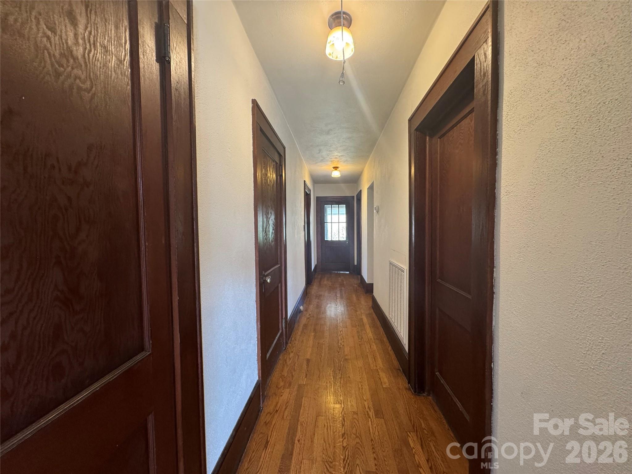 905 Conover Boulevard East Conover, NC 28613 - Photo 11 of 39 a view of a hallway with wooden floor