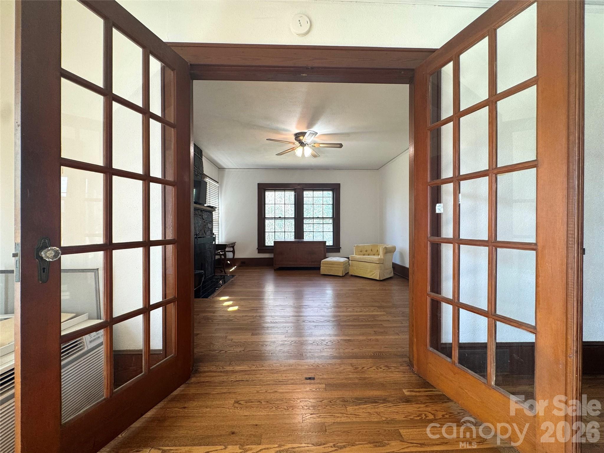 905 Conover Boulevard East Conover, NC 28613 - Photo 10 of 39 a view of livingroom with furniture wooden floor and a floor to ceiling window