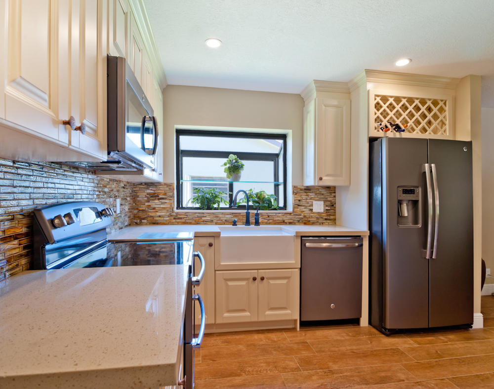 18090 104th Terrace South Boca Raton, FL 33498 - Photo 2 of 25 a kitchen with stainless steel appliances granite countertop a refrigerator a stove a sink and a refrigerator