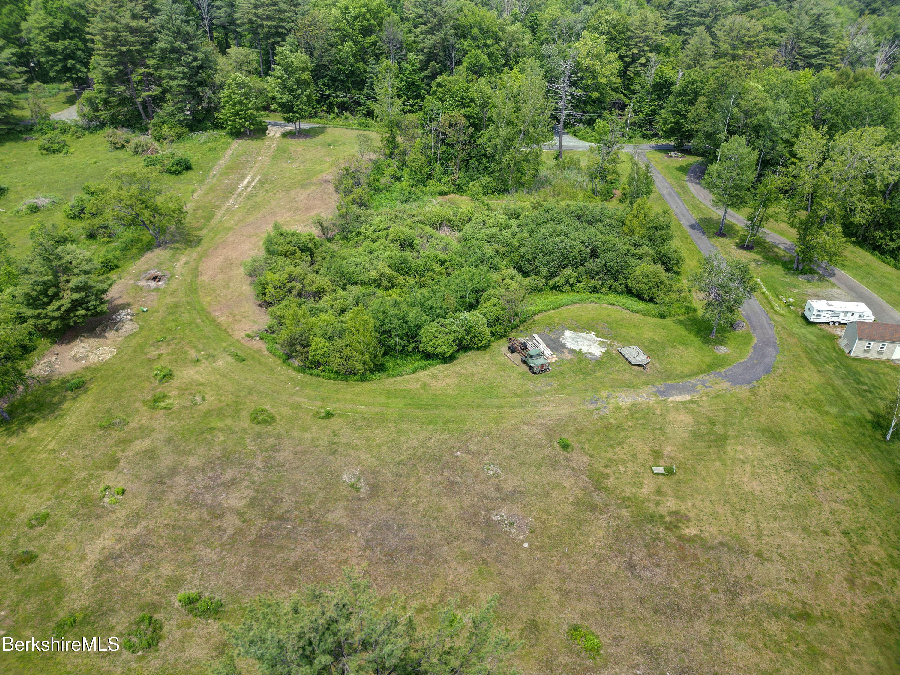 497 Gale Avenue Pittsfield, MA 01201 - Photo 3 of 7 a view of a garden with a lake