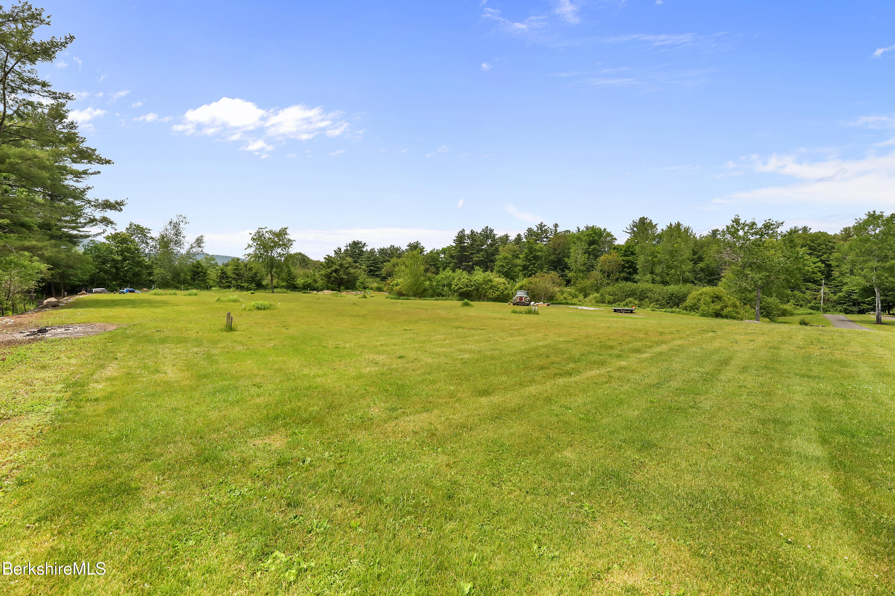 497 Gale Avenue Pittsfield, MA 01201 - Photo 4 of 7 a view of a field with an trees in the background