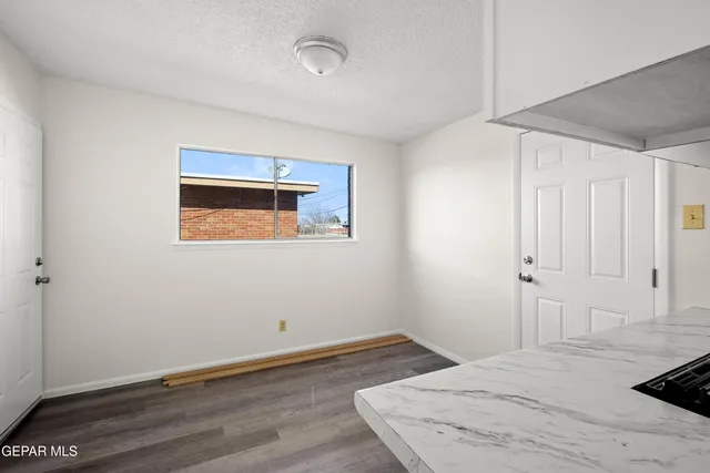 a room that has a bed and a window