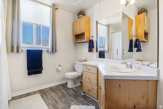 3598 North Huntsman Path, Unit 502 Eden, UT 84310 - Photo 15 of 43 Full bathroom with vanity, dark wood finished floors, and a shower with shower curtain