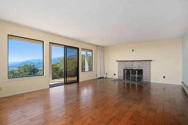 a view of an empty room with windows