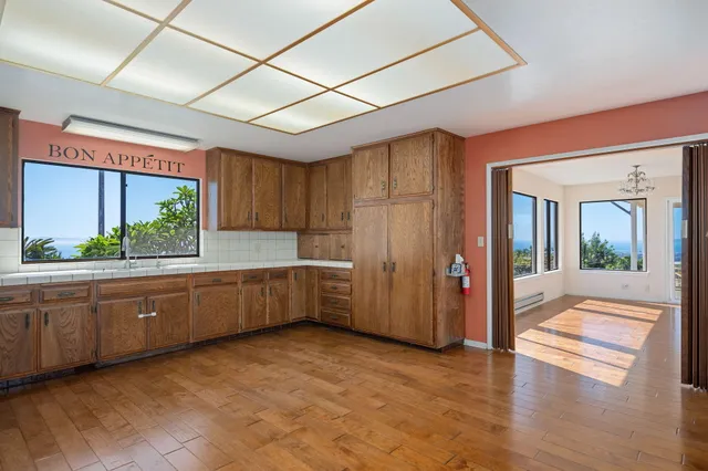 a view of an empty room with windows