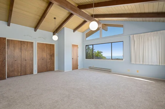 a view of parking garage with cars