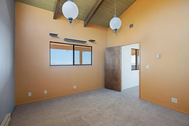 a view of a street with a building in the background