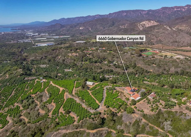 an aerial view of a house with a outdoor space