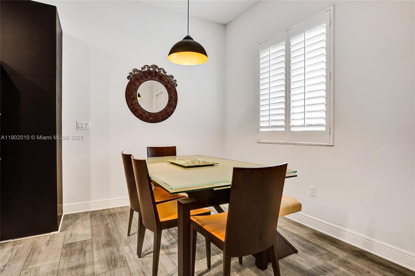 518 North Federal Highway, Unit 14 Lake Worth, FL 33460 - Photo 13 of 54 a view of a dining room with furniture and window