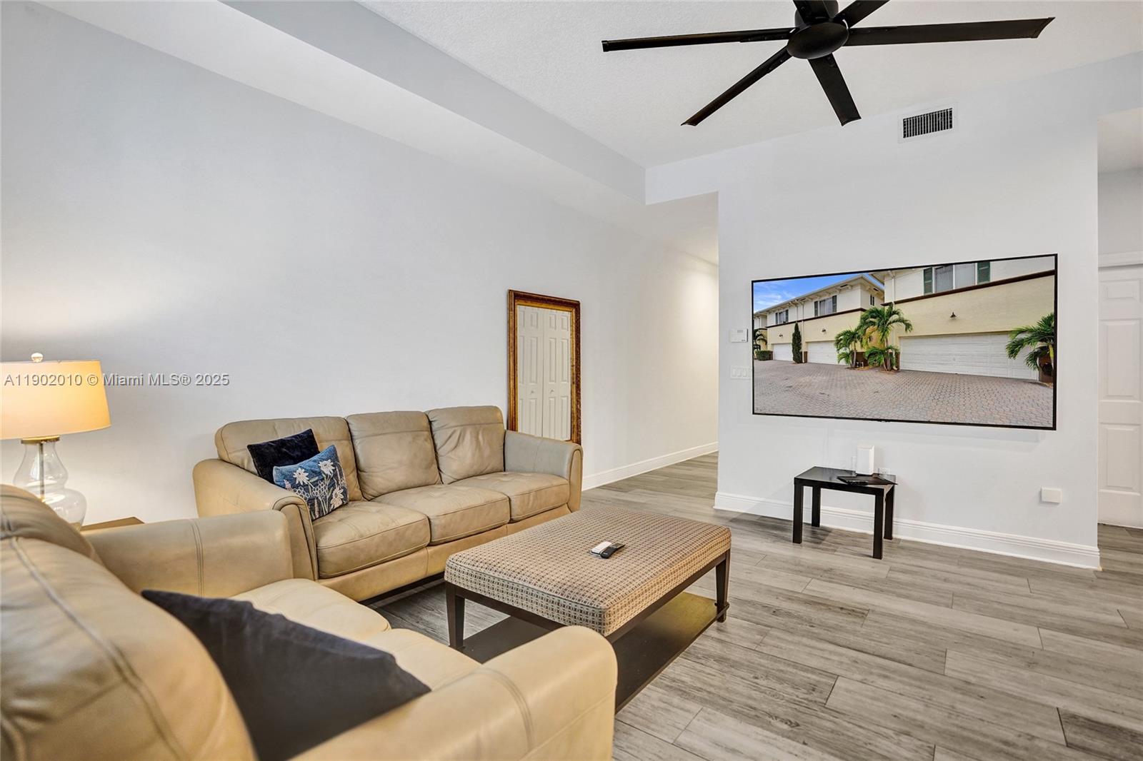 518 North Federal Highway, Unit 14 Lake Worth, FL 33460 - Photo 16 of 54 a living room with furniture and a wooden floor
