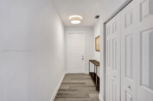 a view of a dining room with furniture and window