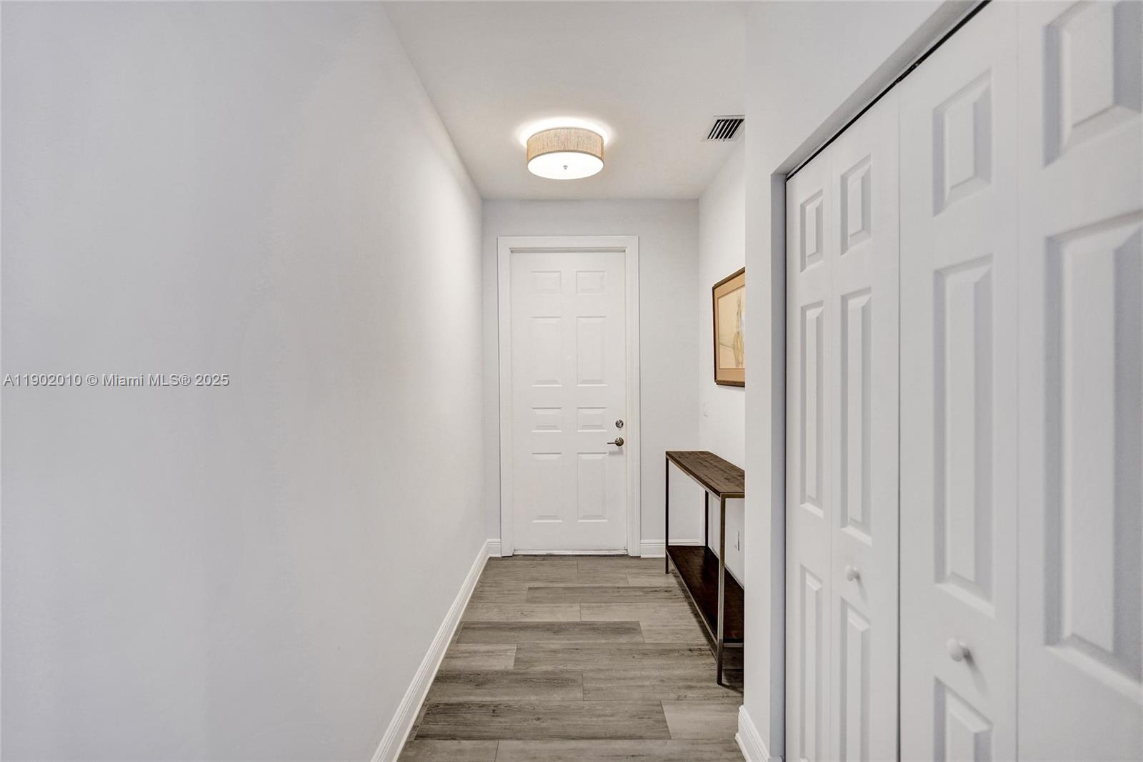 518 North Federal Highway, Unit 14 Lake Worth, FL 33460 - Photo 17 of 54 a view of a hallway with wooden floor and staircase