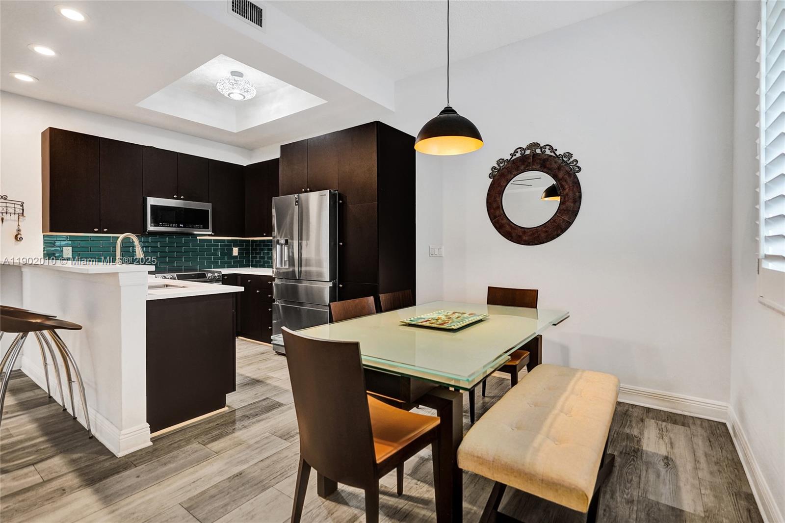 518 North Federal Highway, Unit 14 Lake Worth, FL 33460 - Photo 19 of 54 a kitchen with a dining table and chairs
