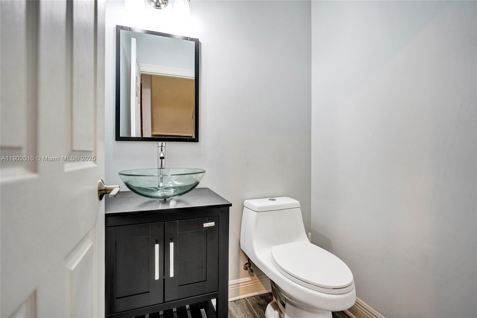 518 North Federal Highway, Unit 14 Lake Worth, FL 33460 - Photo 21 of 54 a bathroom with a toilet a sink and mirror