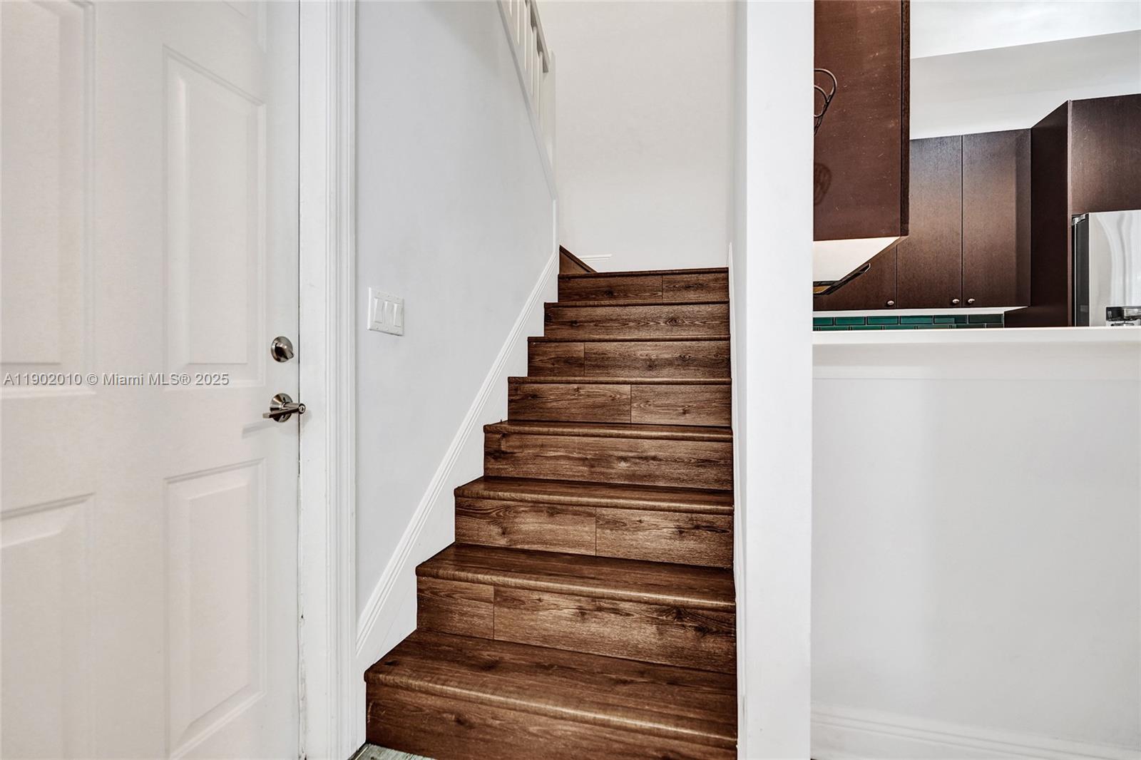 518 North Federal Highway, Unit 14 Lake Worth, FL 33460 - Photo 22 of 54 a view of staircase with wooden floor and windows