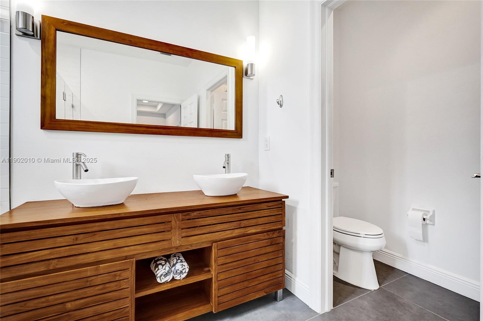 518 North Federal Highway, Unit 14 Lake Worth, FL 33460 - Photo 31 of 54 a bathroom with a sink and a mirror