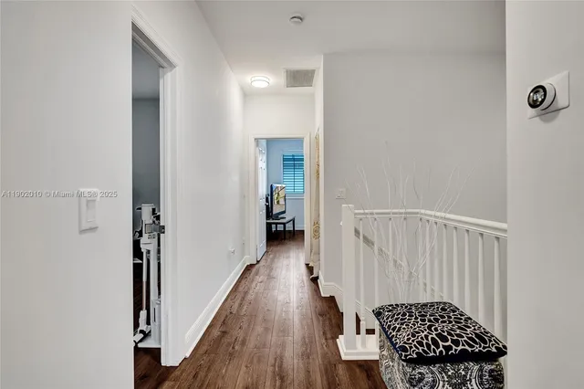 a work room with furniture and a flat screen tv