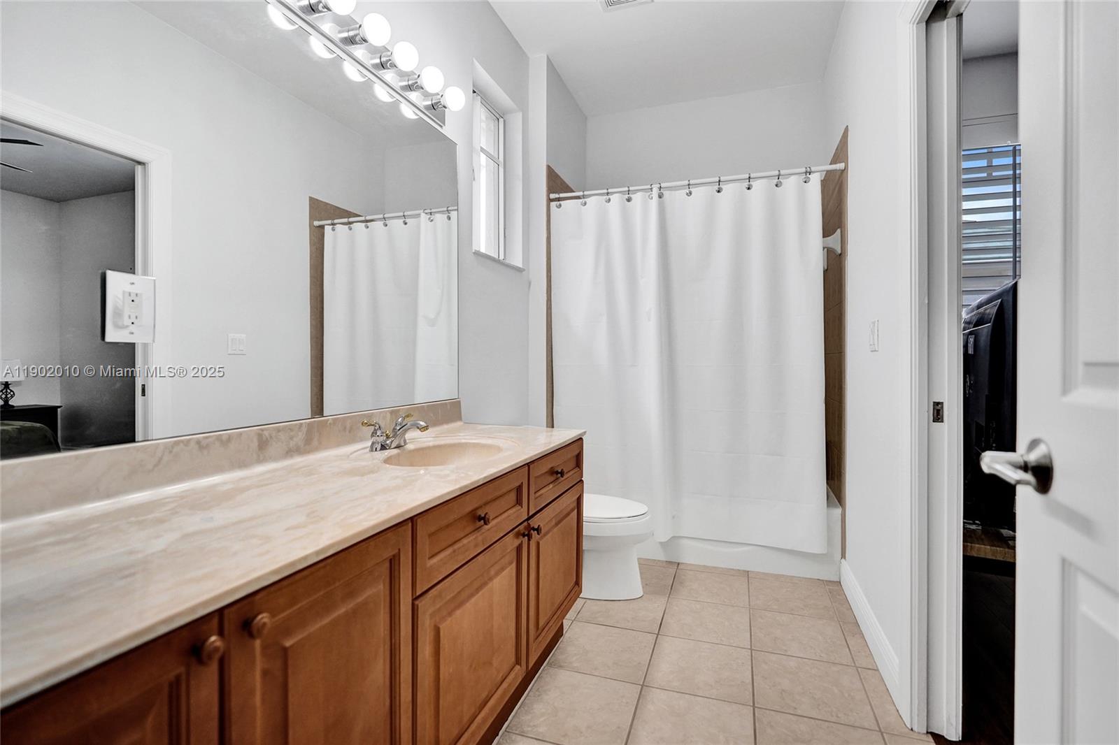 518 North Federal Highway, Unit 14 Lake Worth, FL 33460 - Photo 36 of 54 a bathroom with a granite countertop sink and a mirror