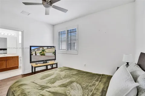 a view of a bedroom with washer and dryer