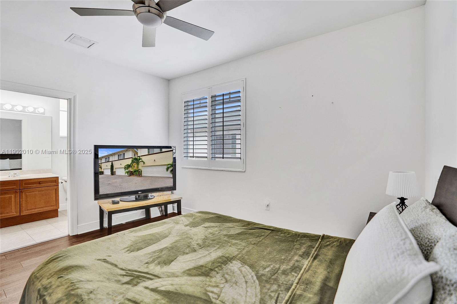 518 North Federal Highway, Unit 14 Lake Worth, FL 33460 - Photo 38 of 54 a bedroom with a bed and a flat screen tv