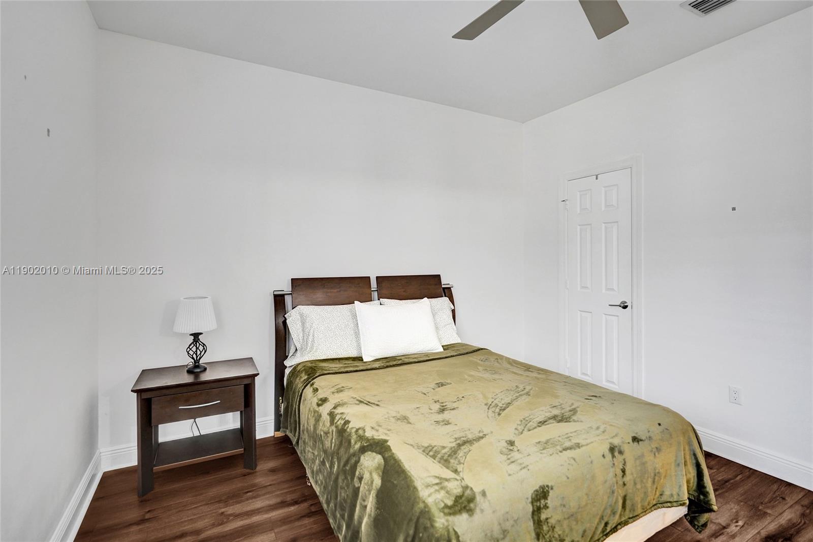 518 North Federal Highway, Unit 14 Lake Worth, FL 33460 - Photo 39 of 54 a bedroom with a bed and a lamp on table
