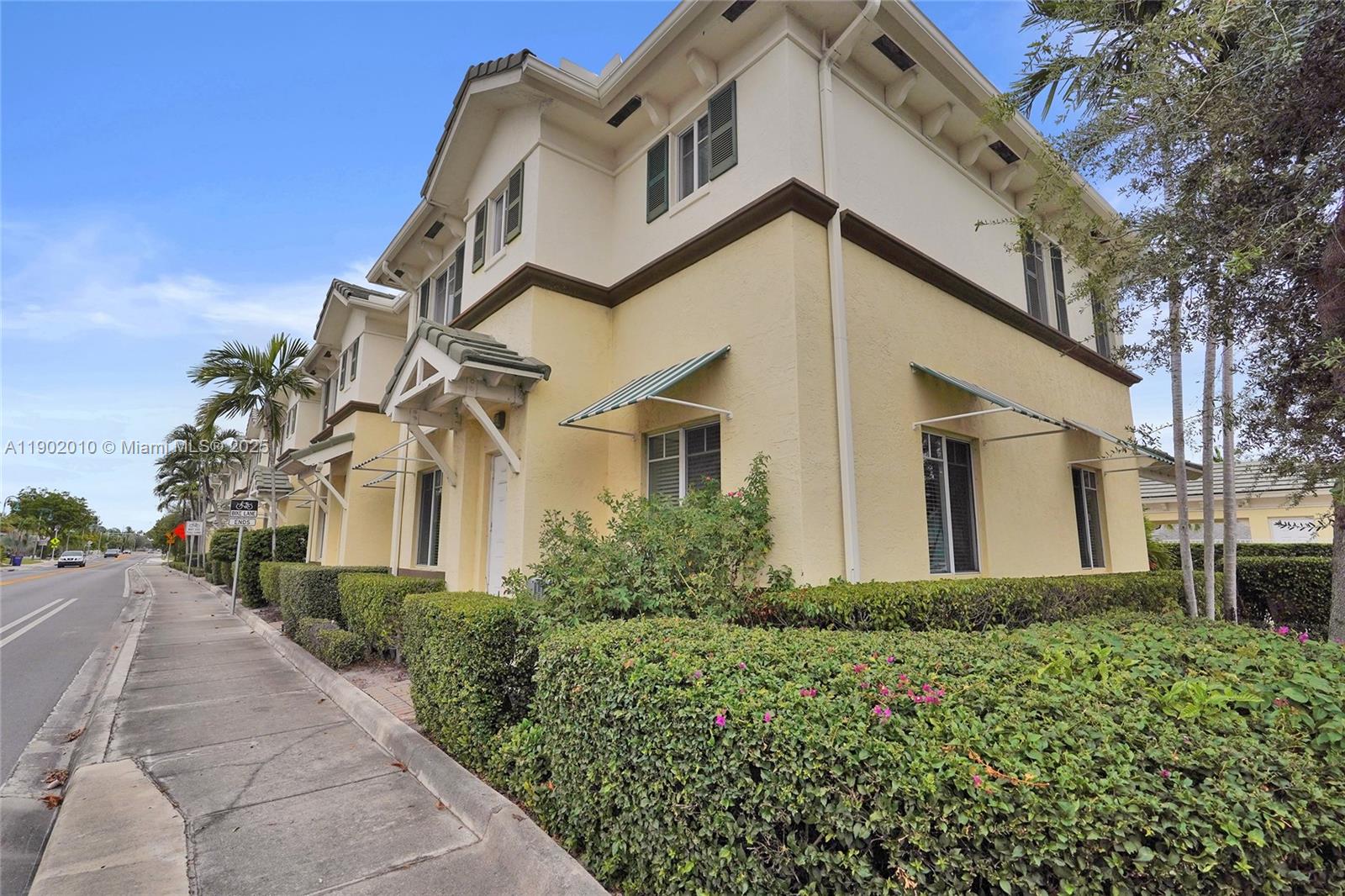 518 North Federal Highway, Unit 14 Lake Worth, FL 33460 - Photo 41 of 54 a view of a white house with a large windows and flower plants