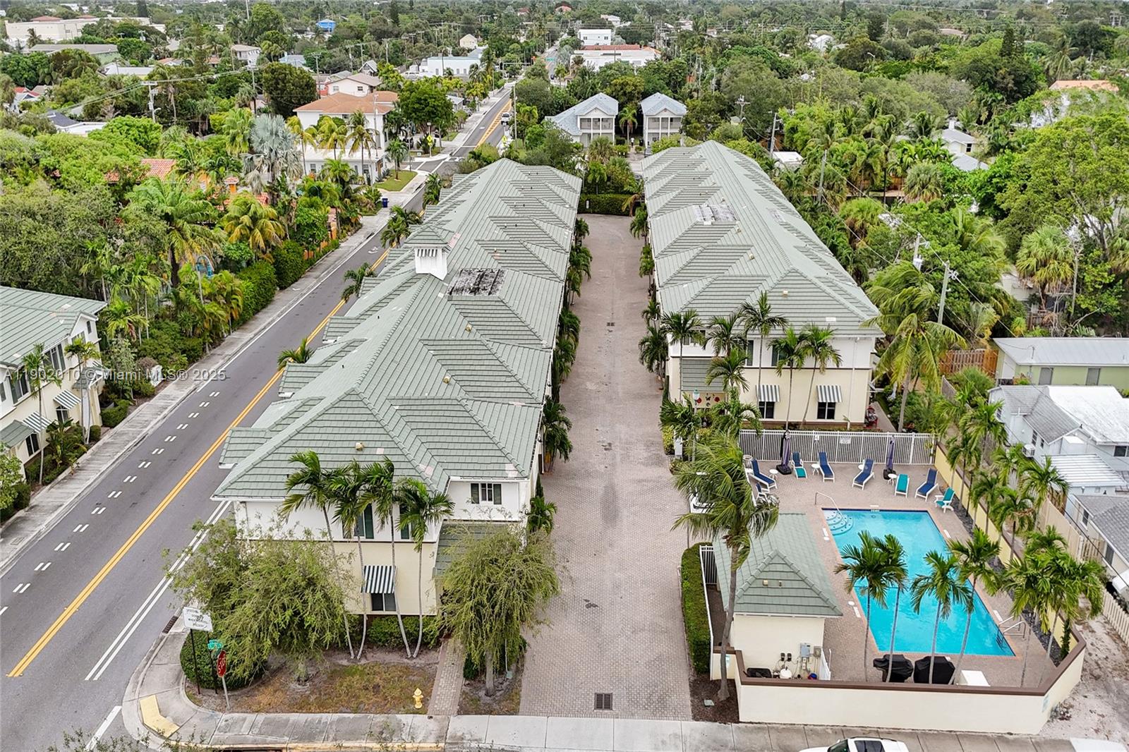 518 North Federal Highway, Unit 14 Lake Worth, FL 33460 - Photo 49 of 54 an aerial view of a residential apartment building with a yard and parking spaces