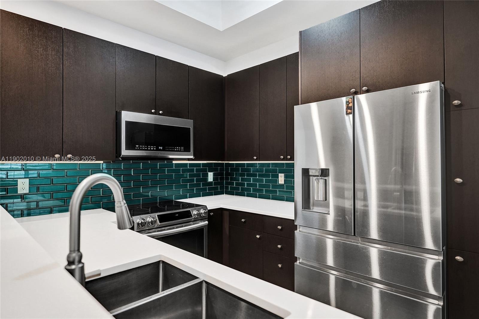 518 North Federal Highway, Unit 14 Lake Worth, FL 33460 - Photo 5 of 54 a kitchen with stainless steel appliances a refrigerator sink and microwave