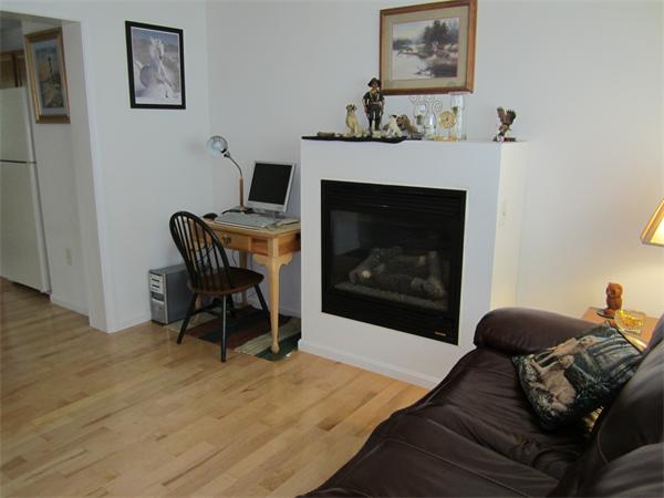 111 Beach Road, Unit 24 Salisbury, MA 01952 - Photo 10 of 13 a living room with furniture and a fireplace