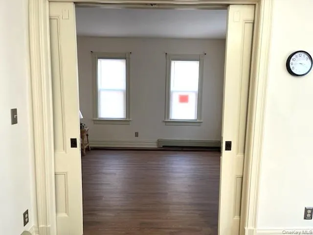 a view of a livingroom with wooden floor