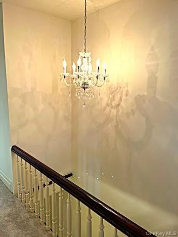 a view of a room with wooden floor and stairs