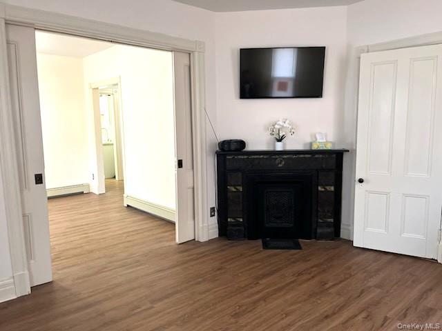 49 Main Street Sparrowbush, NY 12780 - Photo 5 of 21 a living room with a flat screen tv and a fireplace