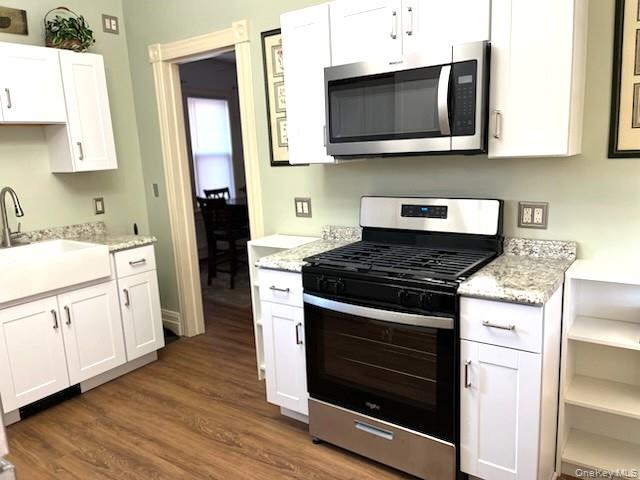 49 Main Street Sparrowbush, NY 12780 - Photo 8 of 21 a kitchen with stainless steel appliances granite countertop a stove and a microwave