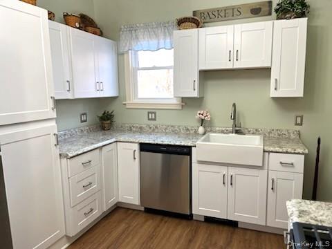 49 Main Street Sparrowbush, NY 12780 - Photo 9 of 21 a kitchen with white cabinets and sink