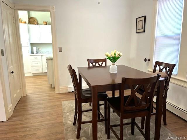 49 Main Street Sparrowbush, NY 12780 - Photo 10 of 21 a view of a dining room with furniture and wooden floor