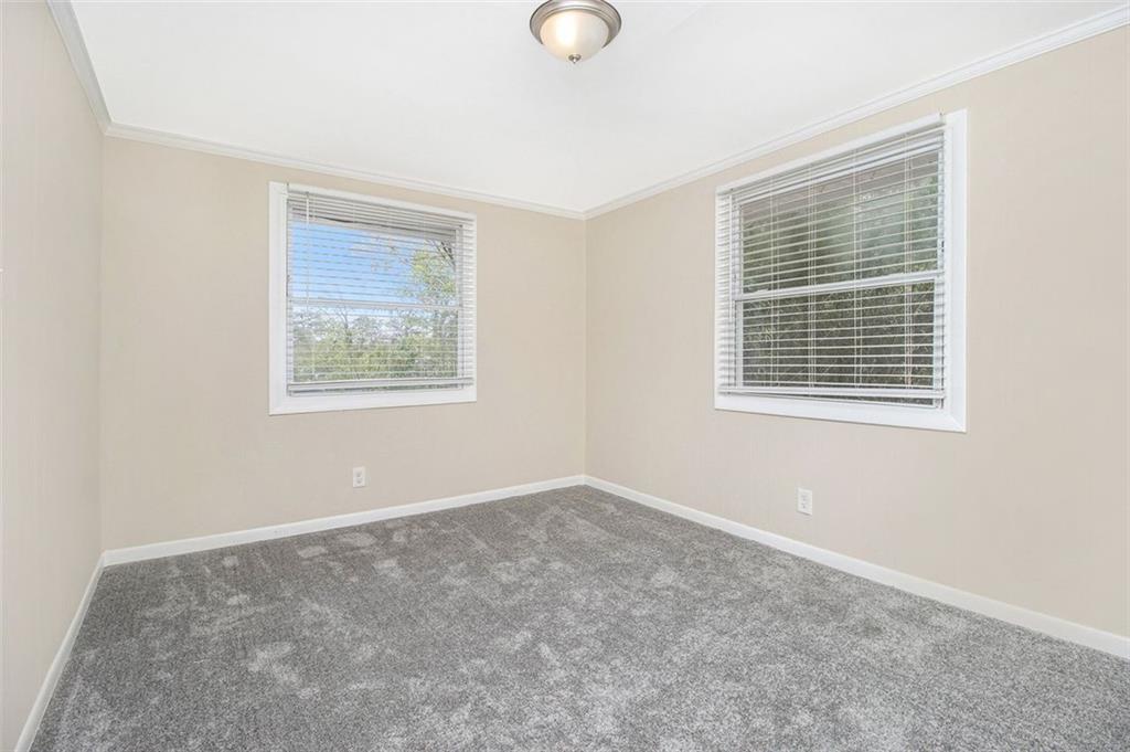 3409 Glensford Drive Decatur, GA 30032 - Photo 11 of 15 a view of an empty room with a window