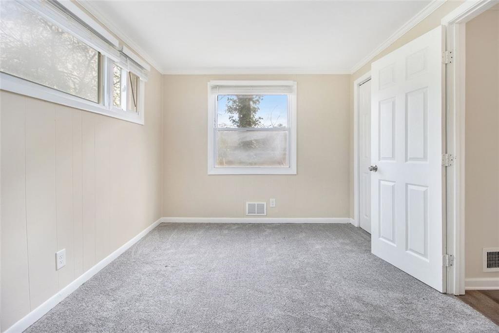 3409 Glensford Drive Decatur, GA 30032 - Photo 8 of 15 an empty room with windows and closet