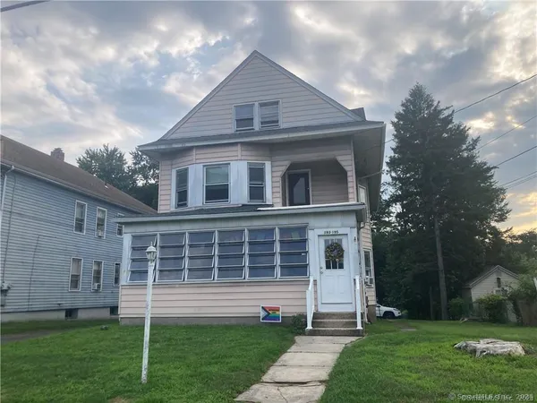 a front view of a house with a yard