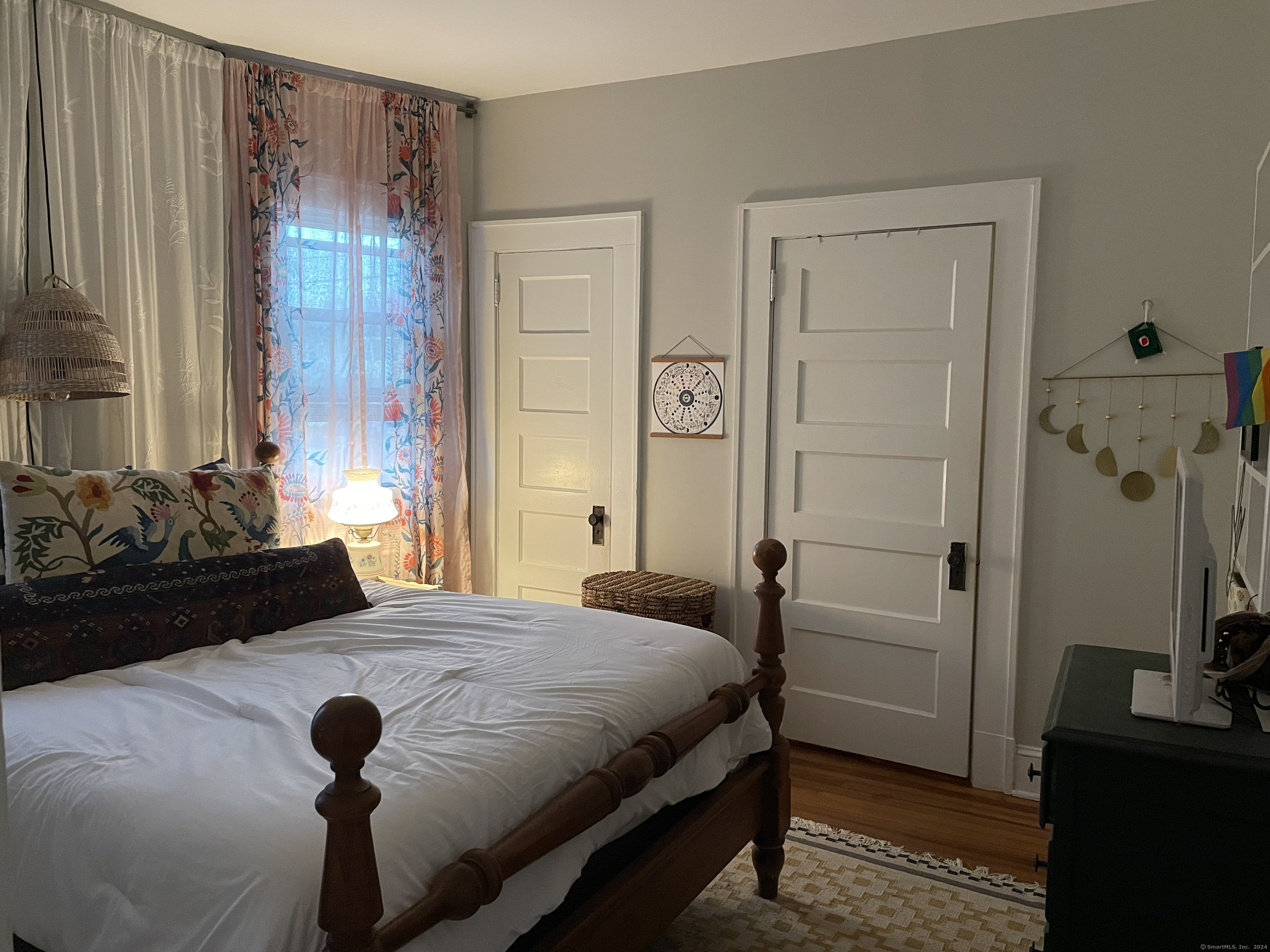 193-195 Wolcott Hill Road Wethersfield, CT 06109 - Photo 12 of 29 a bedroom with a bed and a mirror