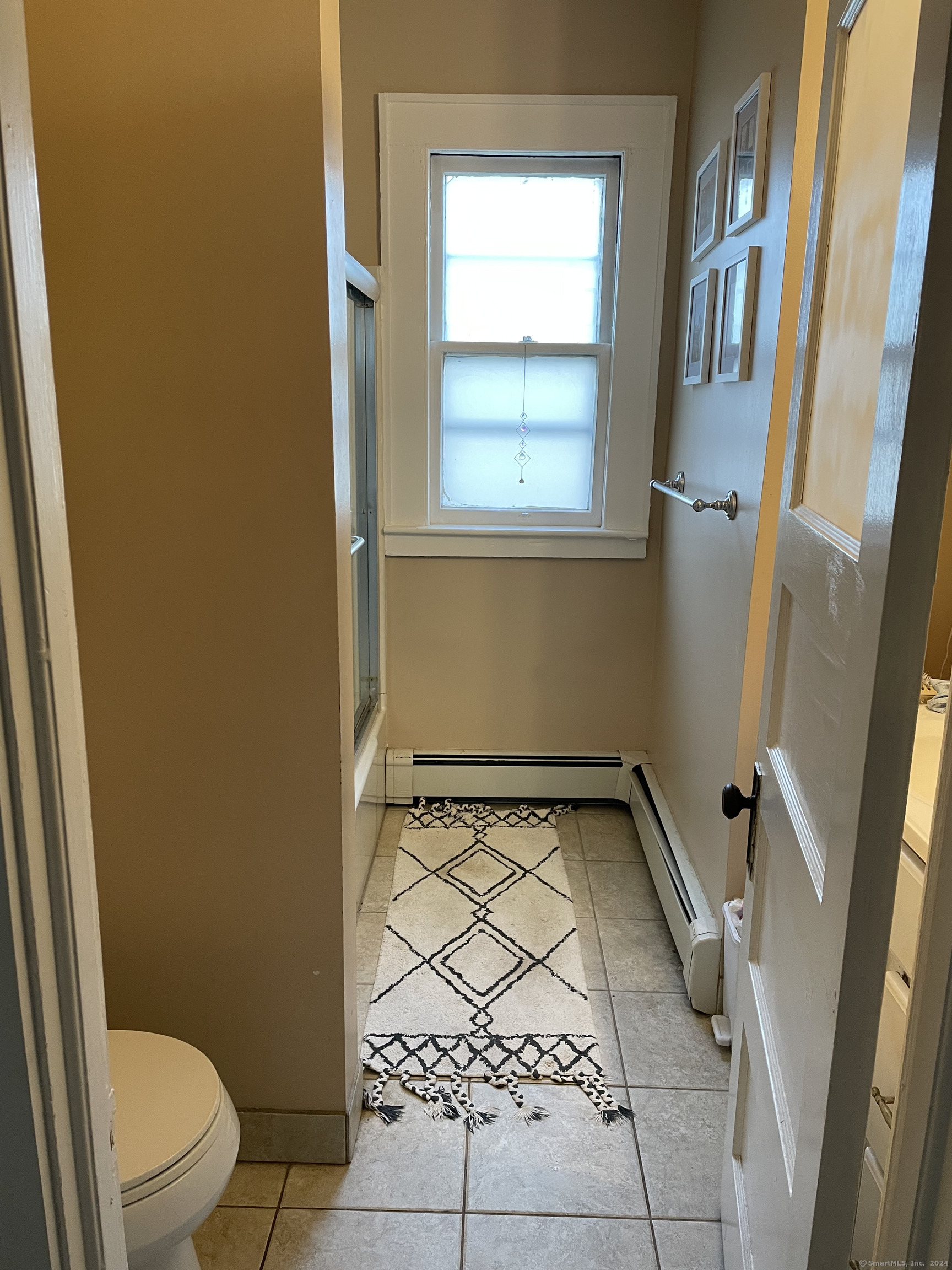 193-195 Wolcott Hill Road Wethersfield, CT 06109 - Photo 13 of 29 a bathroom with a toilet and a shower