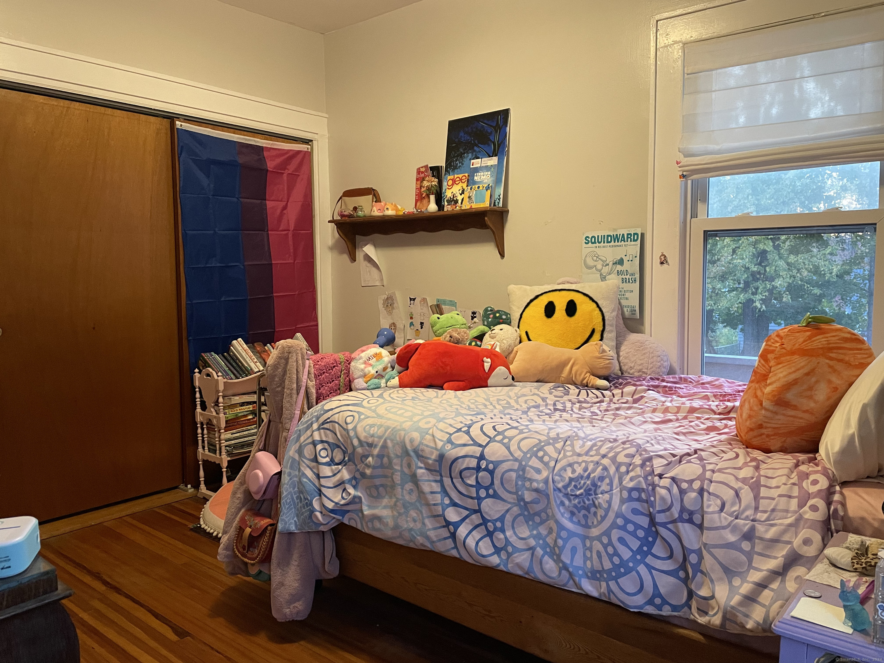 193-195 Wolcott Hill Road Wethersfield, CT 06109 - Photo 15 of 29 a bedroom with a bed and wooden floor