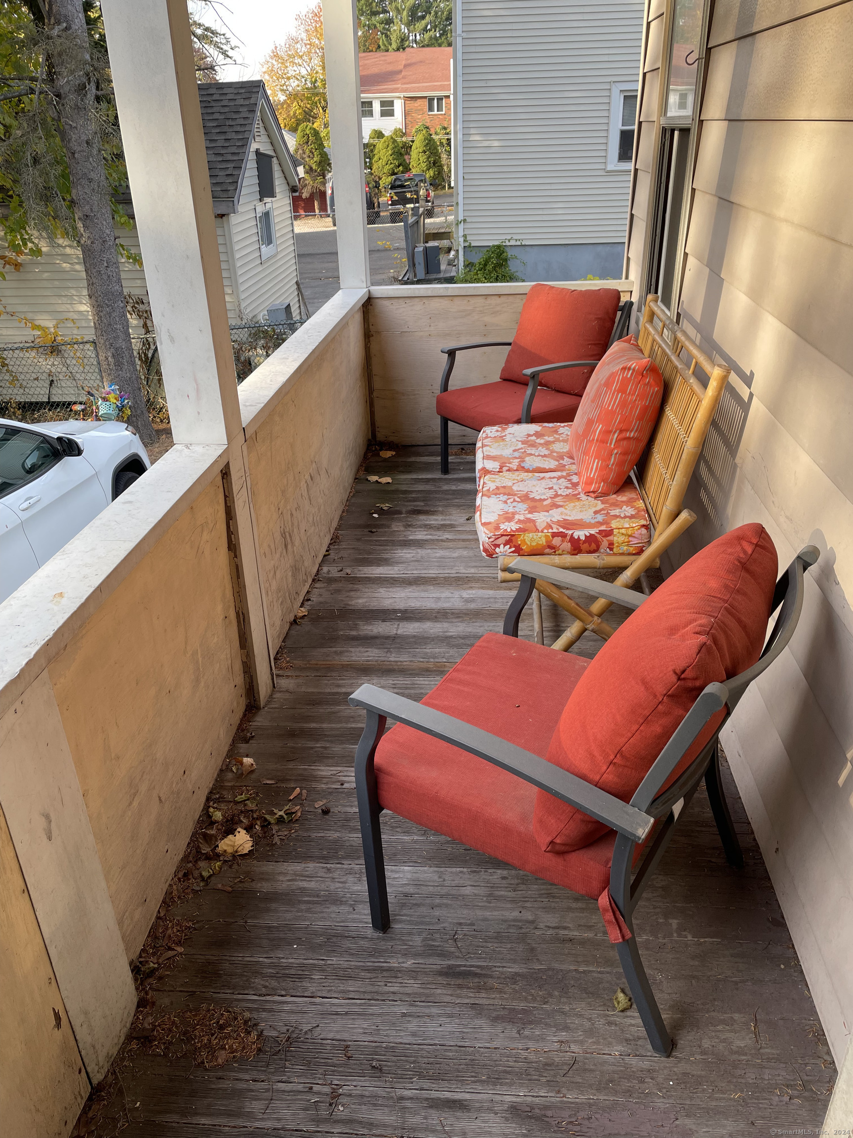 193-195 Wolcott Hill Road Wethersfield, CT 06109 - Photo 2 of 29 a outdoor sitting area with furniture and wooden floor