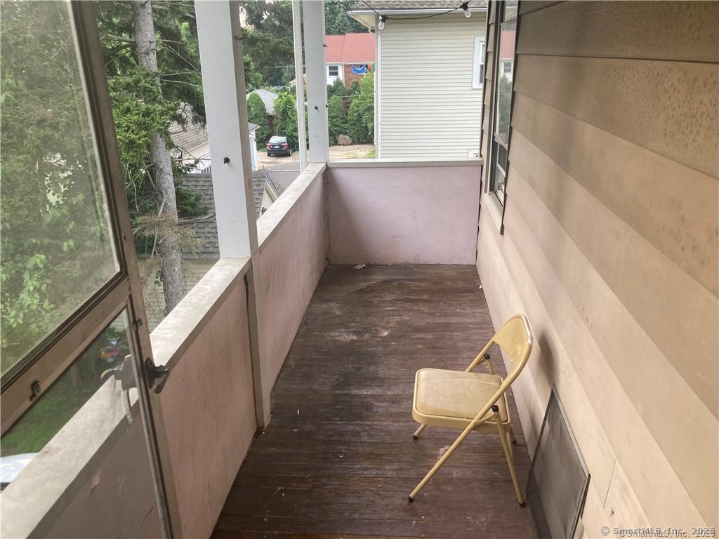 193-195 Wolcott Hill Road Wethersfield, CT 06109 - Photo 28 of 29 a view of balcony with wooden floor and outdoor space