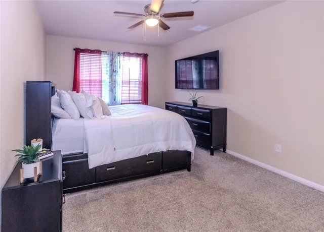 a kitchen with granite countertop a refrigerator stove and sink
