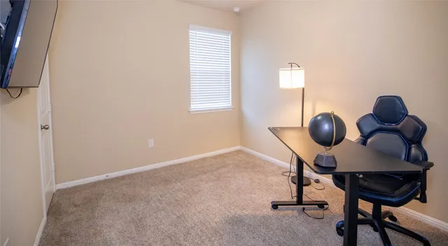 a view of a workspace with furniture